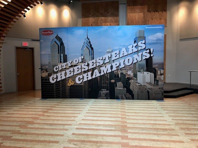 Large printed backdrop installed in an event space