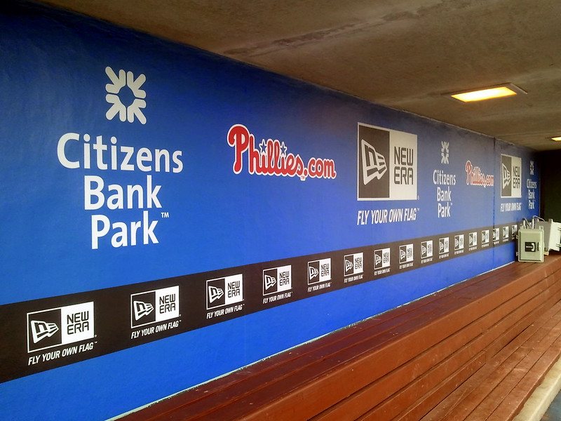 Printed wall graphic running the length of a stadium concourse