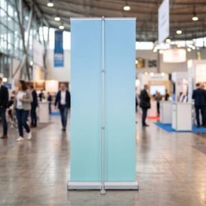 Retractable roll-up banner stand with a blank face in an exhibition hall